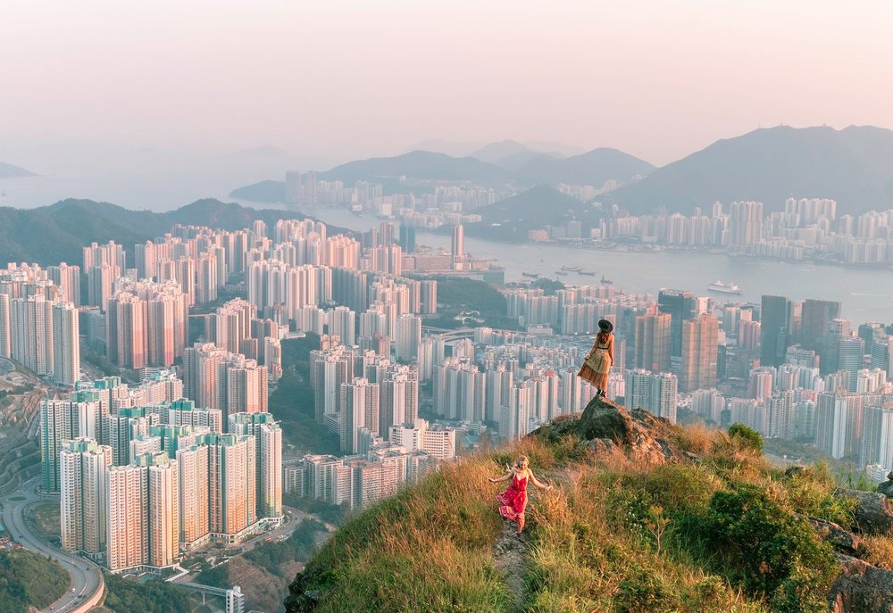 Two girls in a hill over looking hong kong