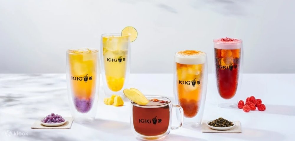 Different fruit drinks lined up on a table 