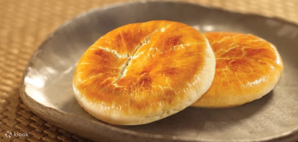 Two pastries on a grey plate