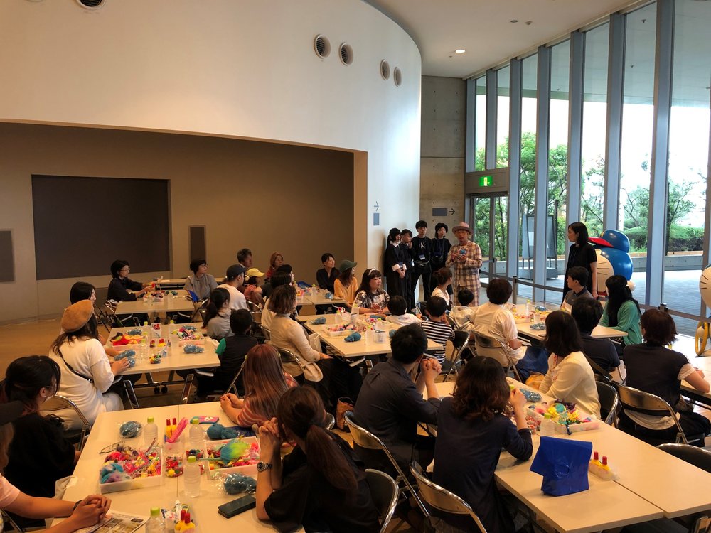 People participating in a Doraemon exhibit workshop