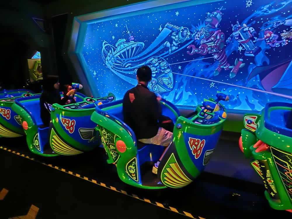 People on a Buzz Lightyear-themed ride
