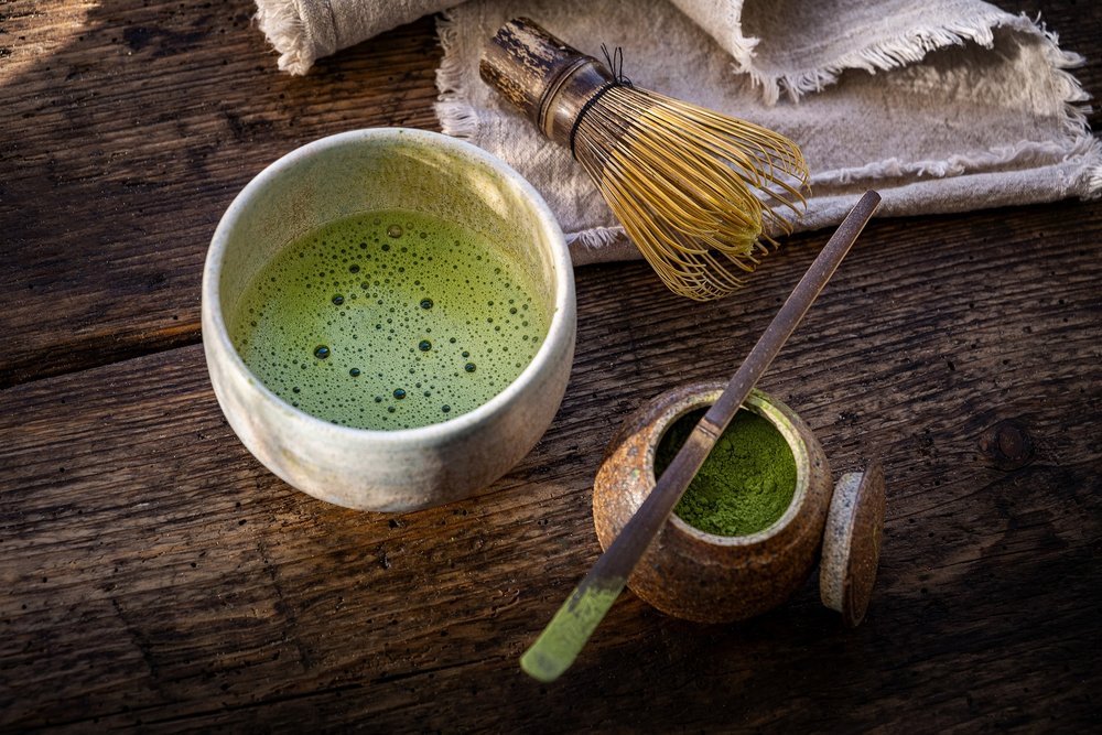 Matcha powder and matcha tea set on a table