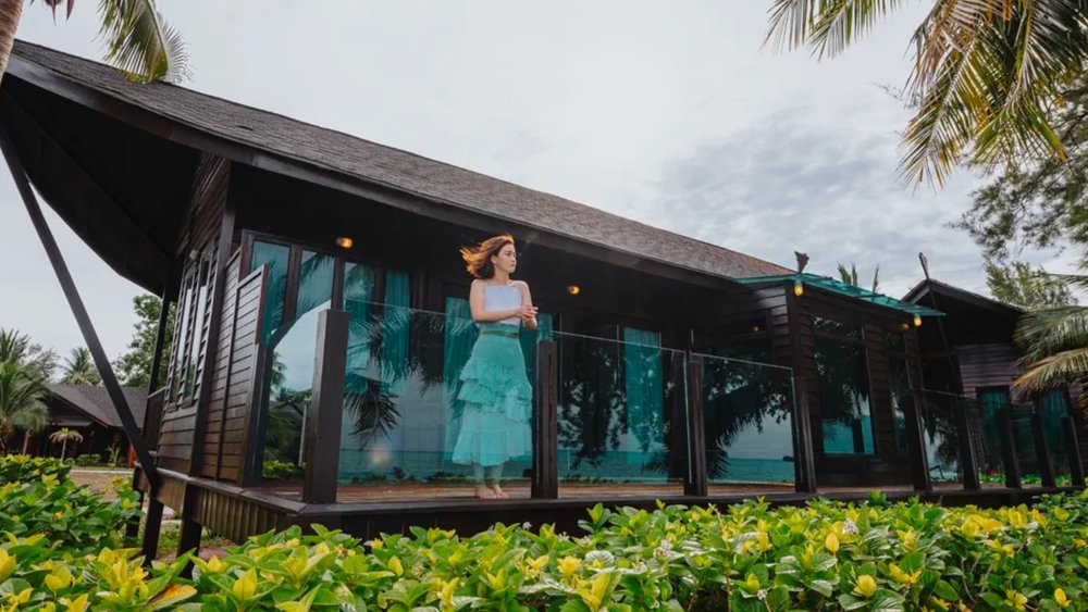 a girl enjoying the view of her villa at Makatang Island Reef Resort