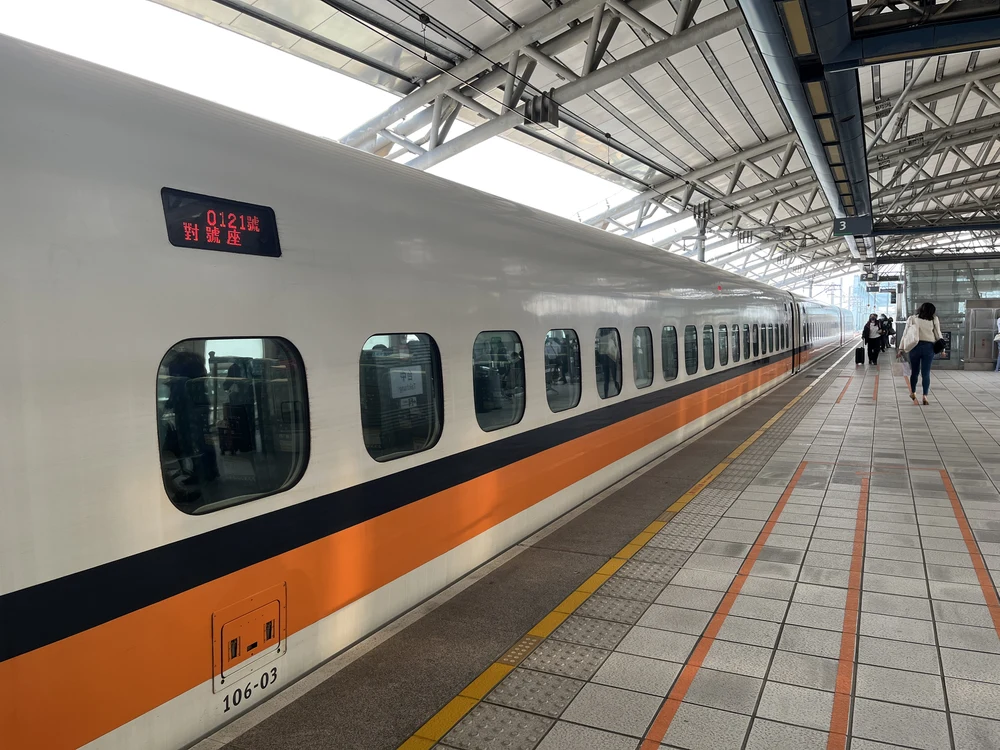 An orange and white train in Taiwan