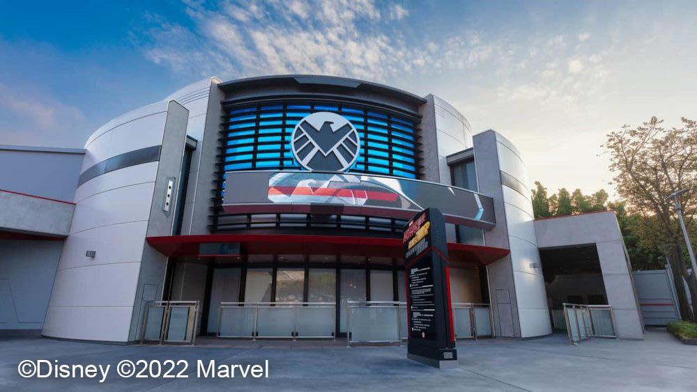 X-MEN logo and building