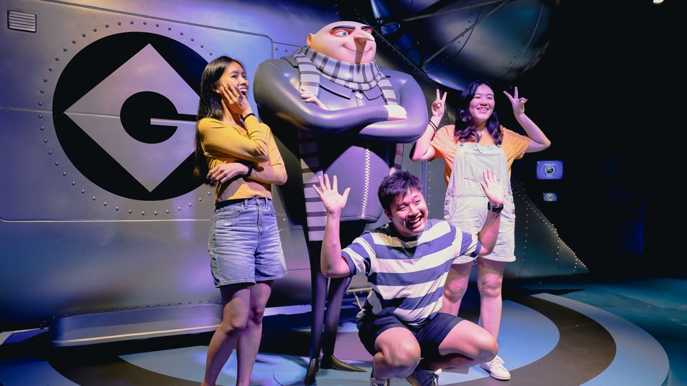 kids posing with Gru at A Minion's Perspective Experience