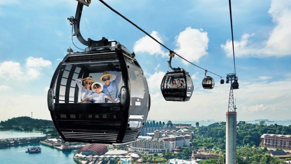 a family riding the Singapore Cable Car