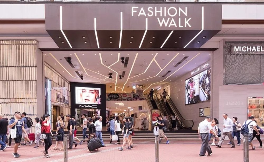 People walking by the entrance of Fashion Walk in Hong Kong