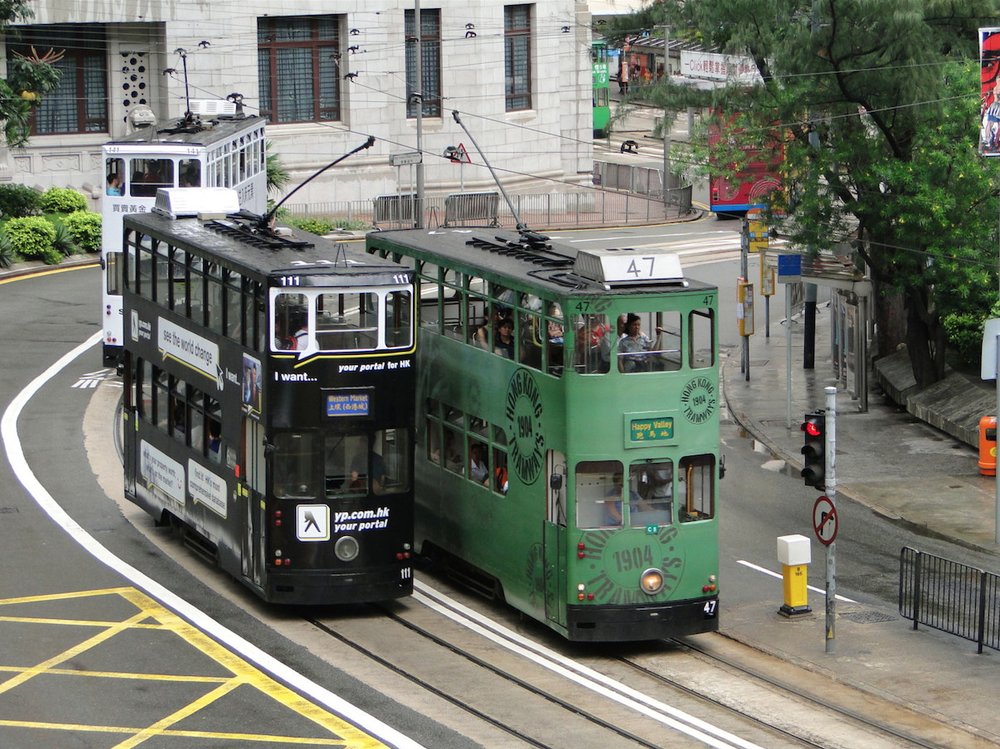 Green and black trains in Hong Kong