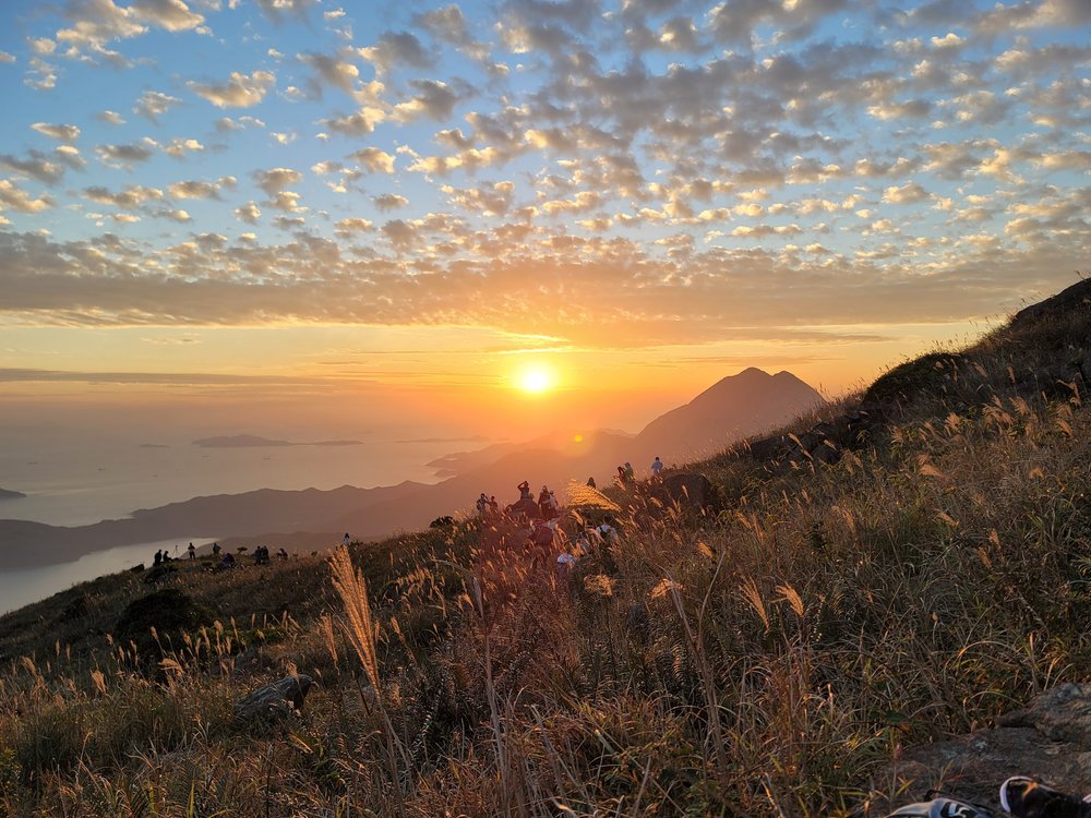 sunset over sunset peak on lantau island
