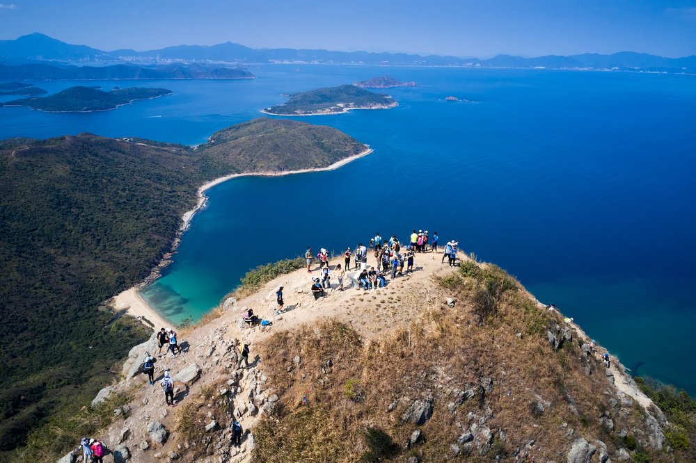 people on top of high junk peak rock