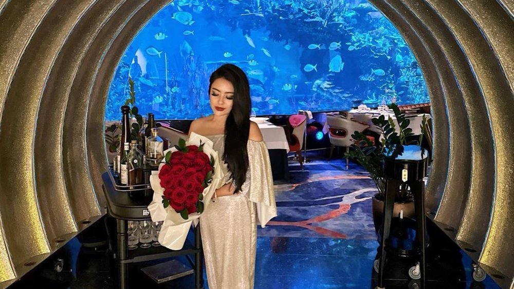 a woman posing at Al Mahara Seafood