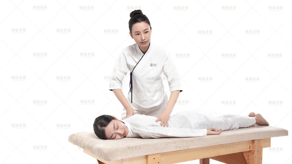 Woman on a massage bed getting a massage