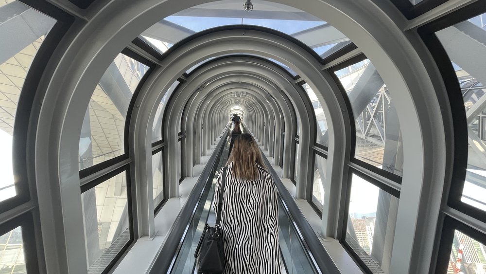woman going up umeda sky building