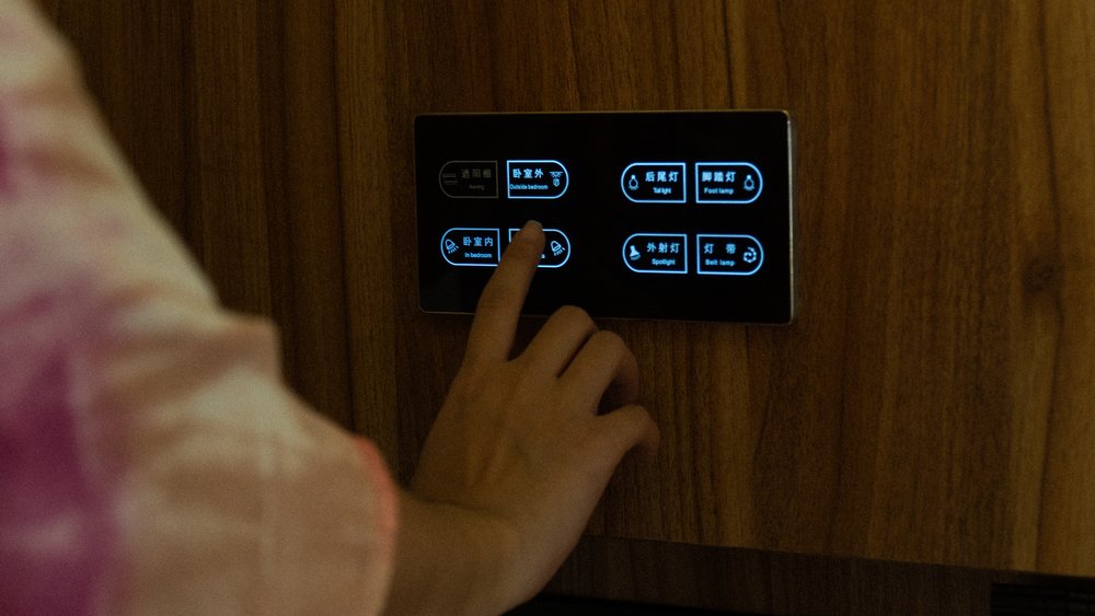 hand touching lighting controls
