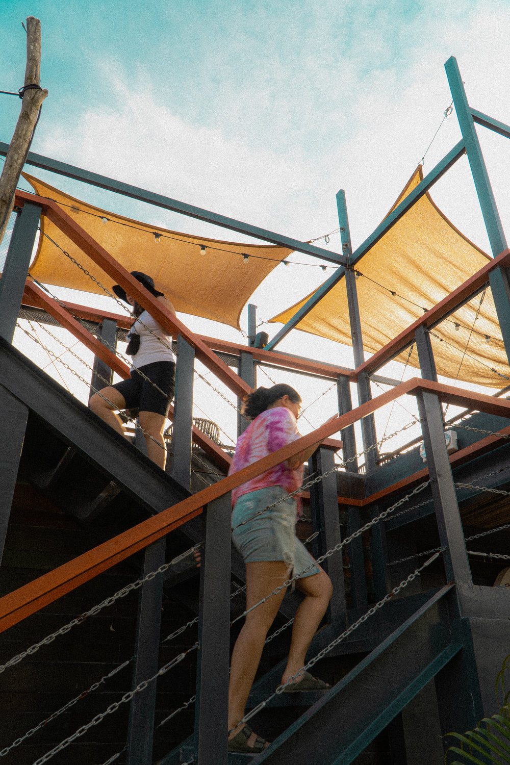 two girls walking up the stairs