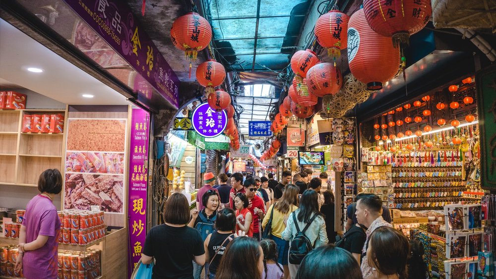people walking along jiufen old street