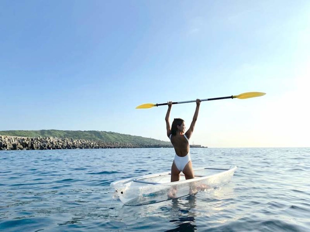 girl on a clear kayak
