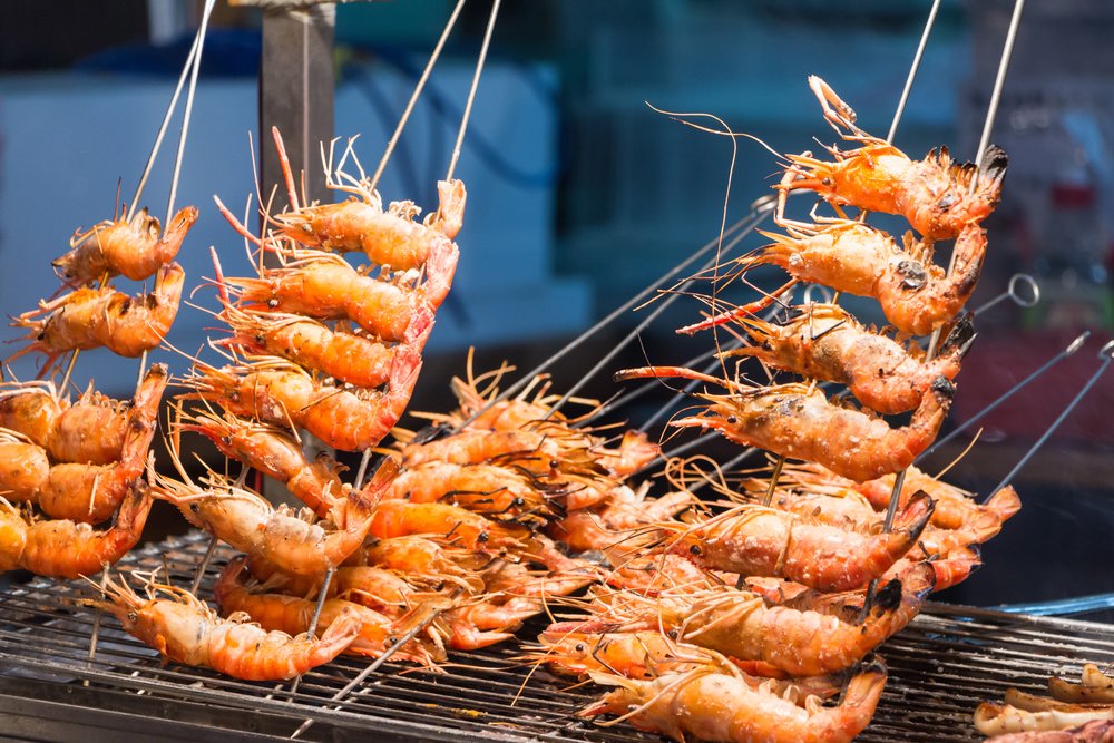skewered shrimps grilling