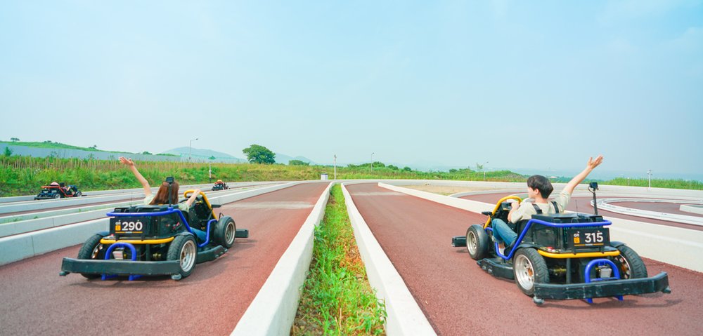 Man and woman on karts driving together