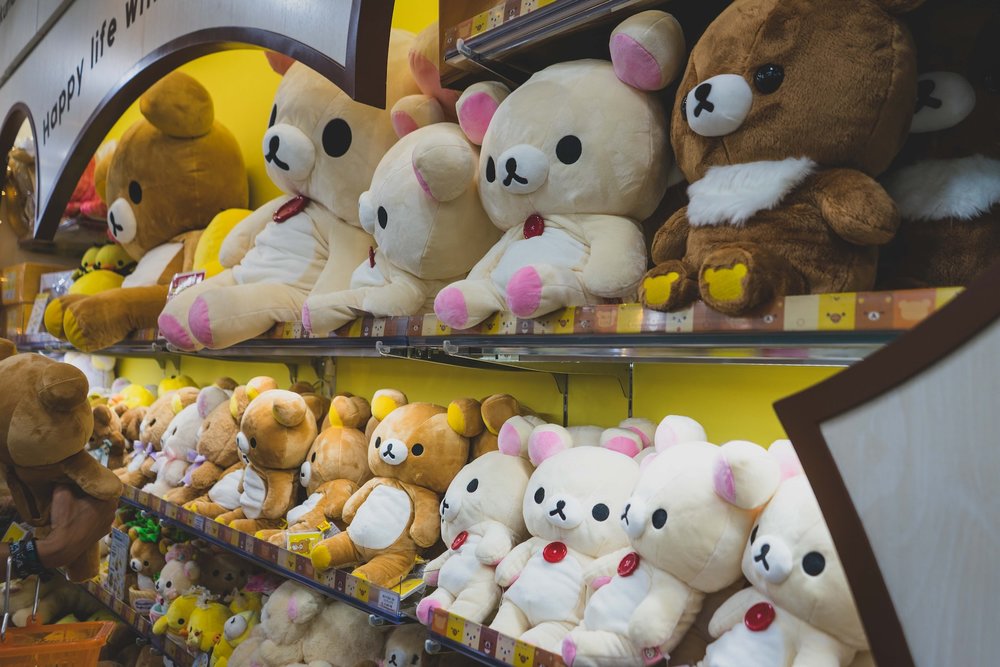 shelves with rilakkuma bear stuffed toys