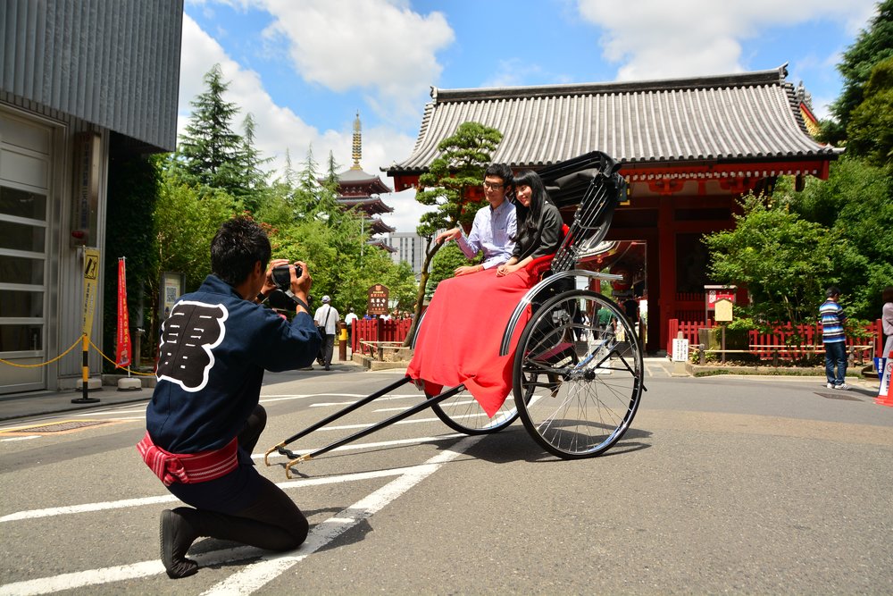 people trying out a rickshaw