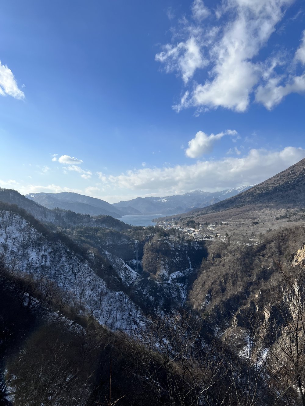 a view of nikko's mountains and lake chuzenji in the winter