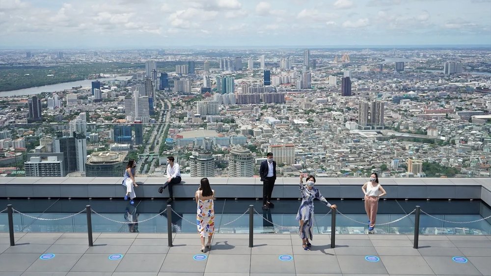 people taking photos at the building's rooftop