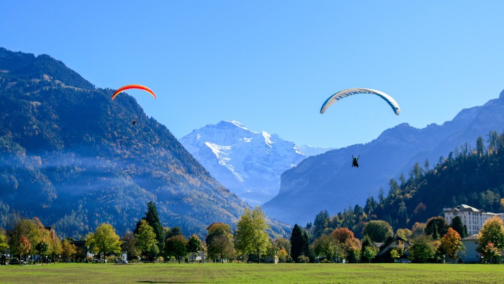 people paragliding in interlaken in spring