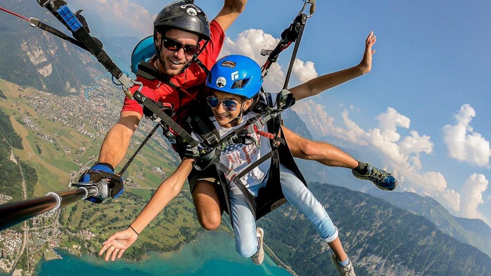 two people having fun paragliding in Interlaken