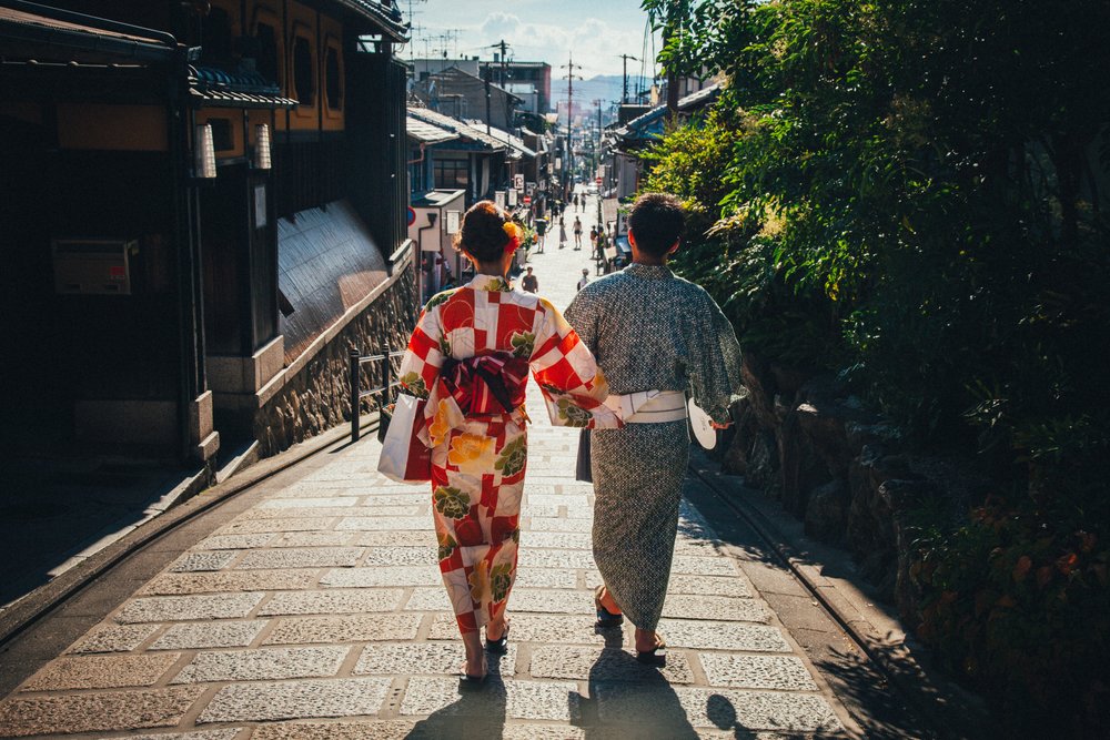 Man and woman walking together in traditional Japanese clothing