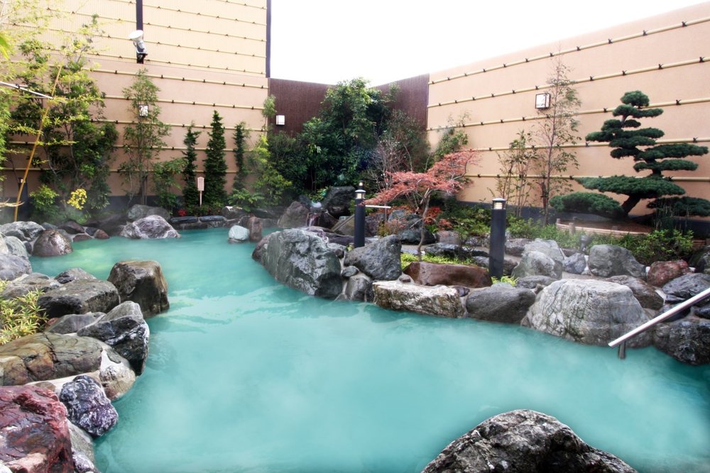 An outdoor hot spring surrounded by nature