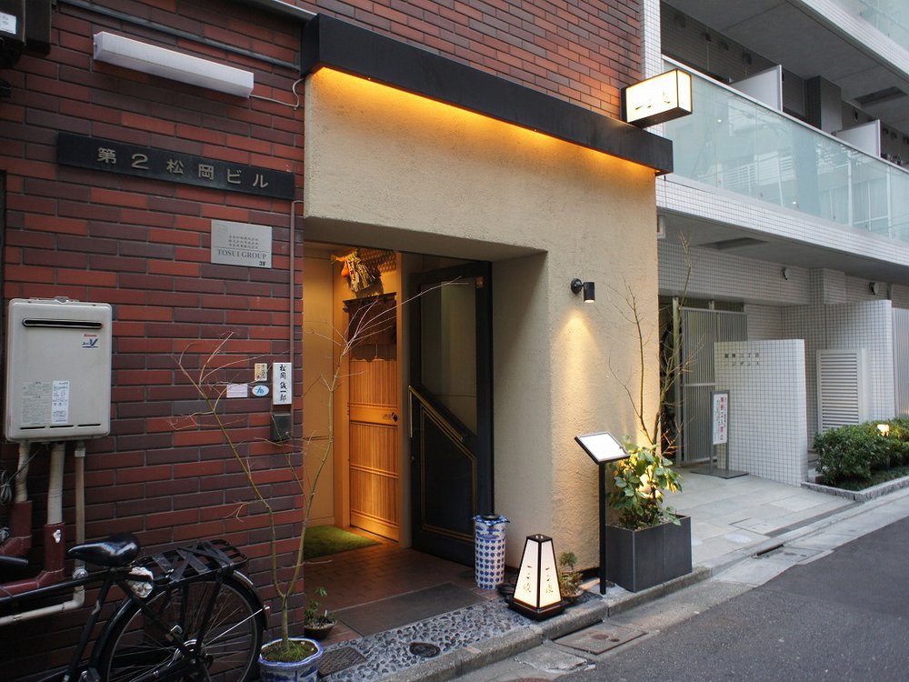 a restaurant entrance along a small street