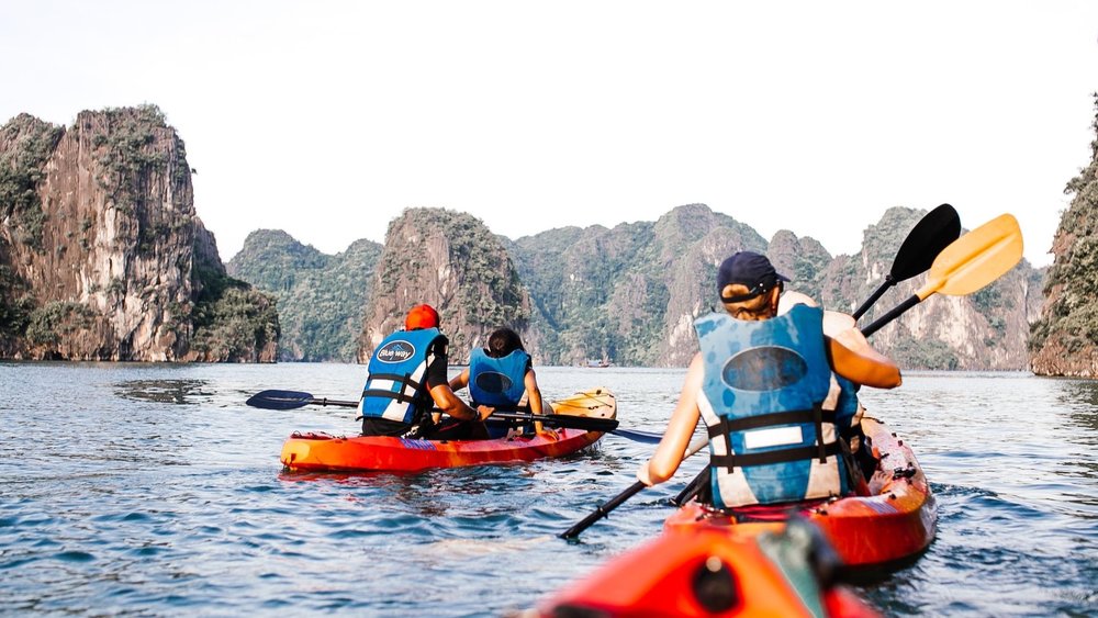 people kayaking in Halong Bay
