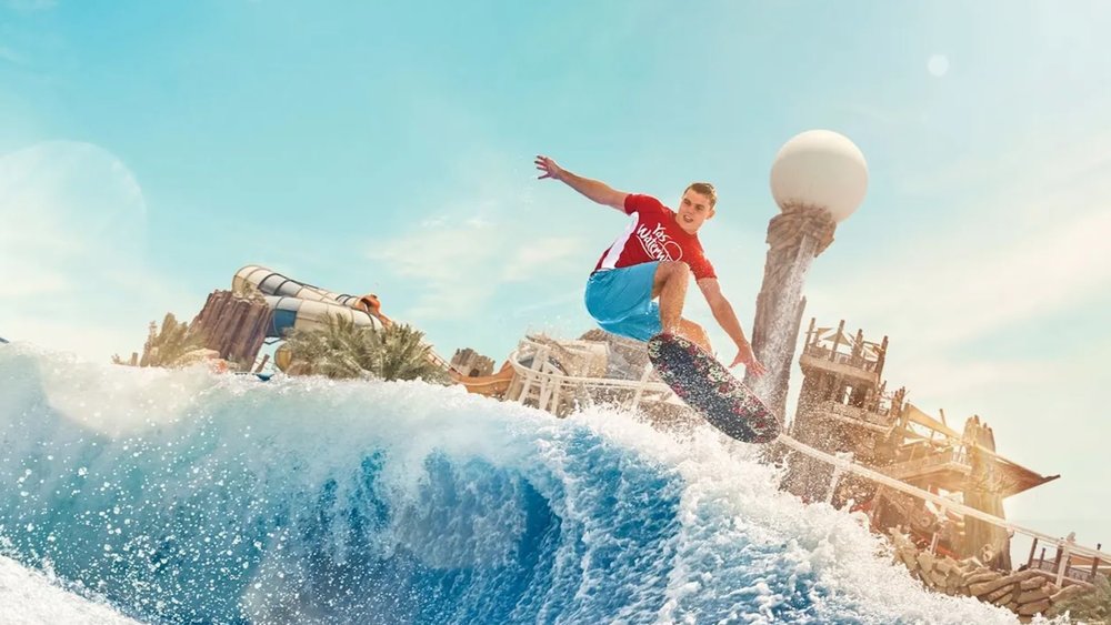 a man enjoying the wave pool at Yas Waterworld