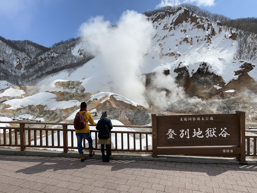 People looking at the mountains in winter