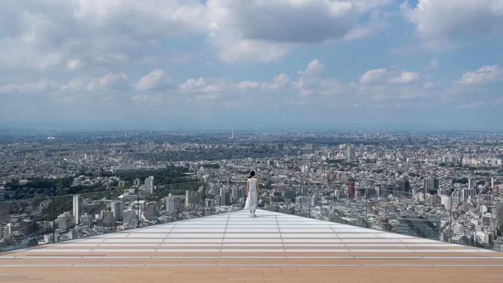 a woman standing in the middle of the Sky Edge
