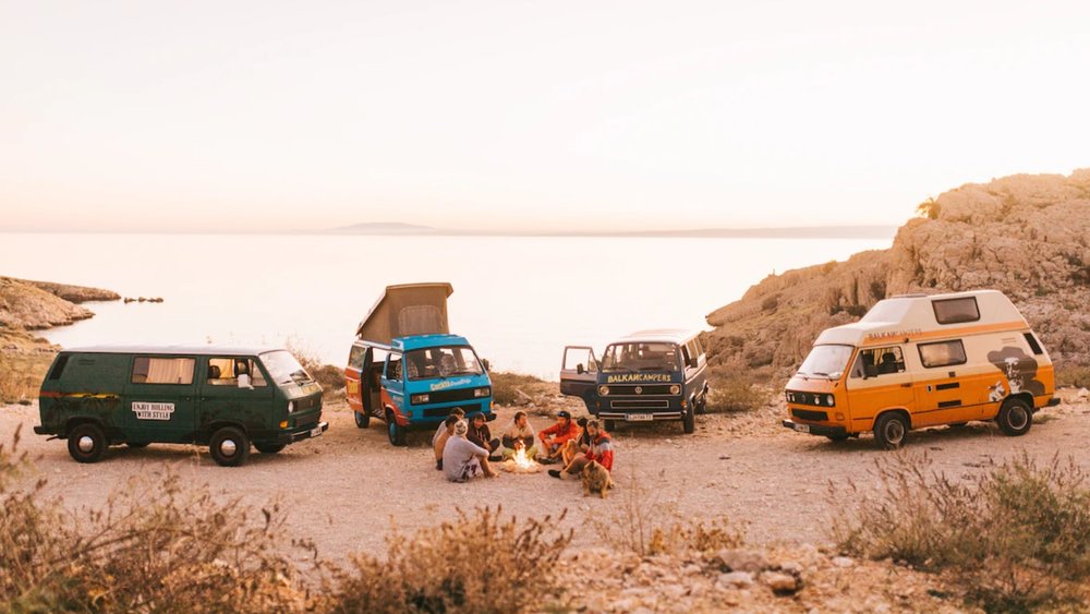 people gathered around a campfire