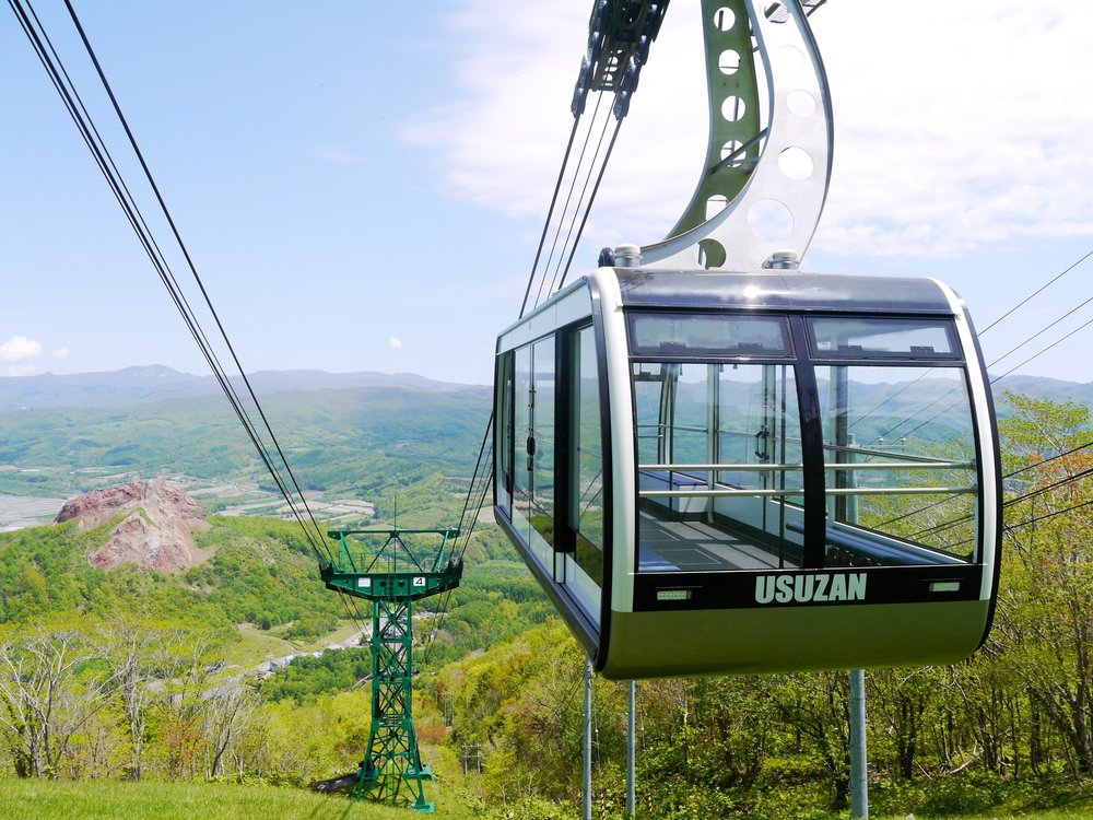 A cable car surrounded by nature