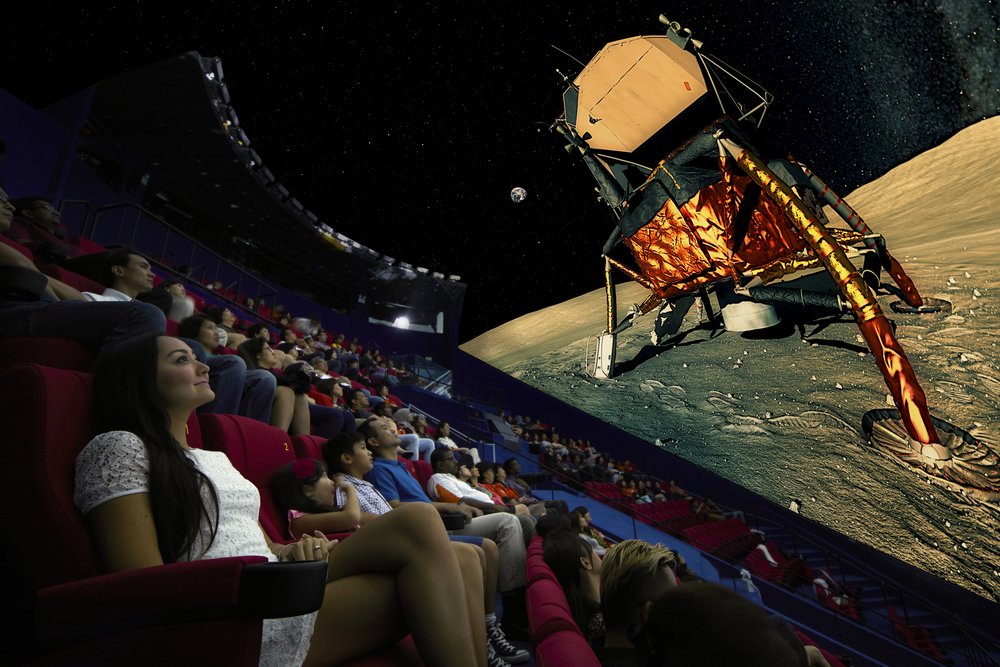 People happily watching a movie