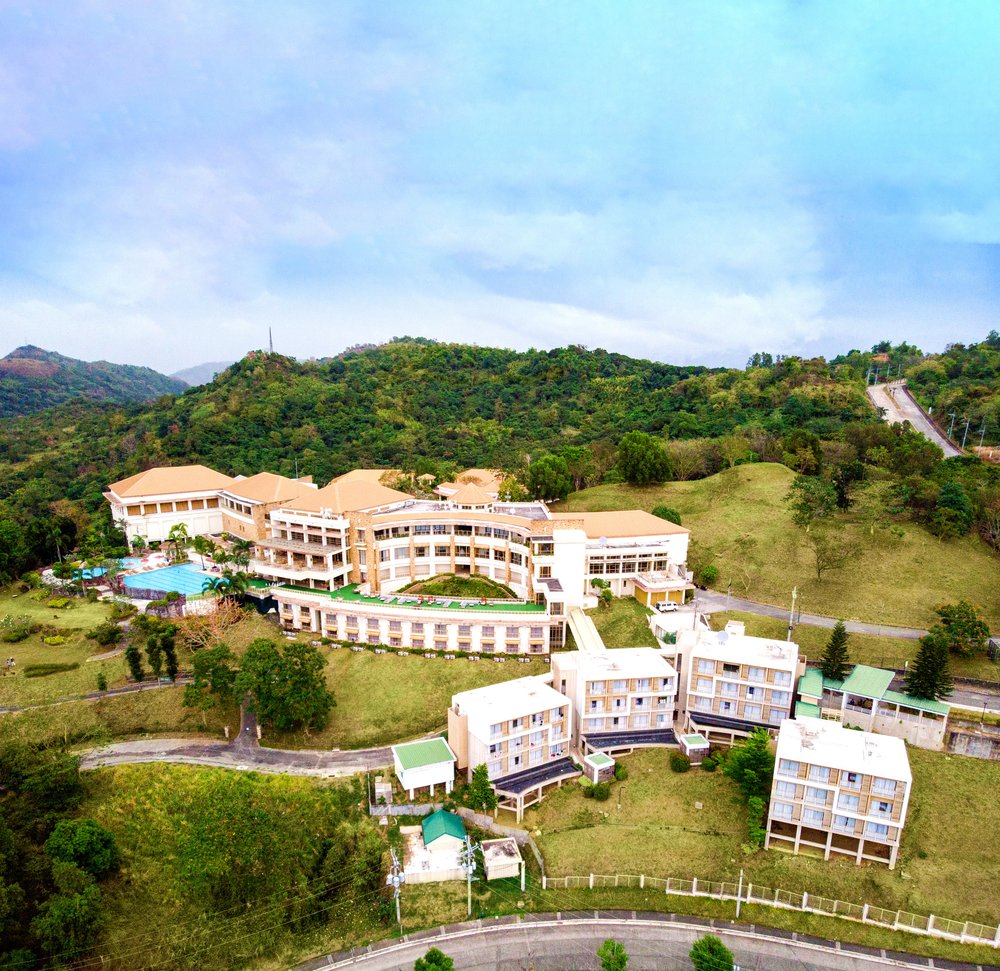 aerial shot of resort by moutainside