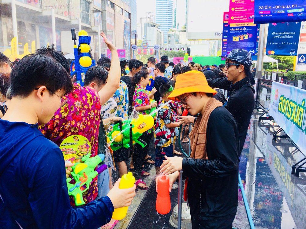 Thai water festival with water pistol fight to celebrate Songkran