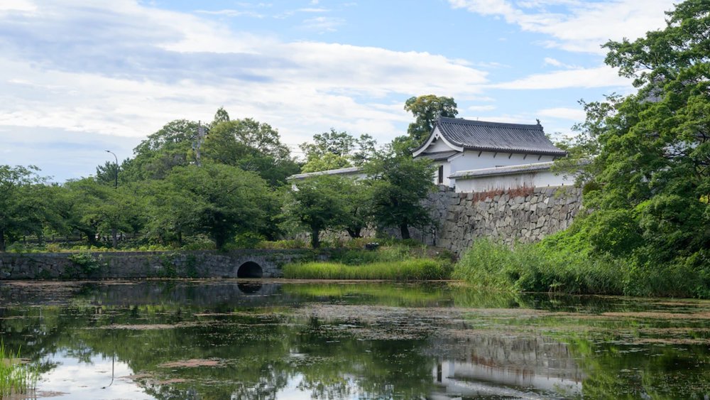 pond in front of japanese castle
