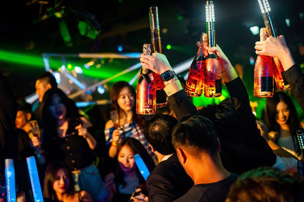 People partying with drinks in hand