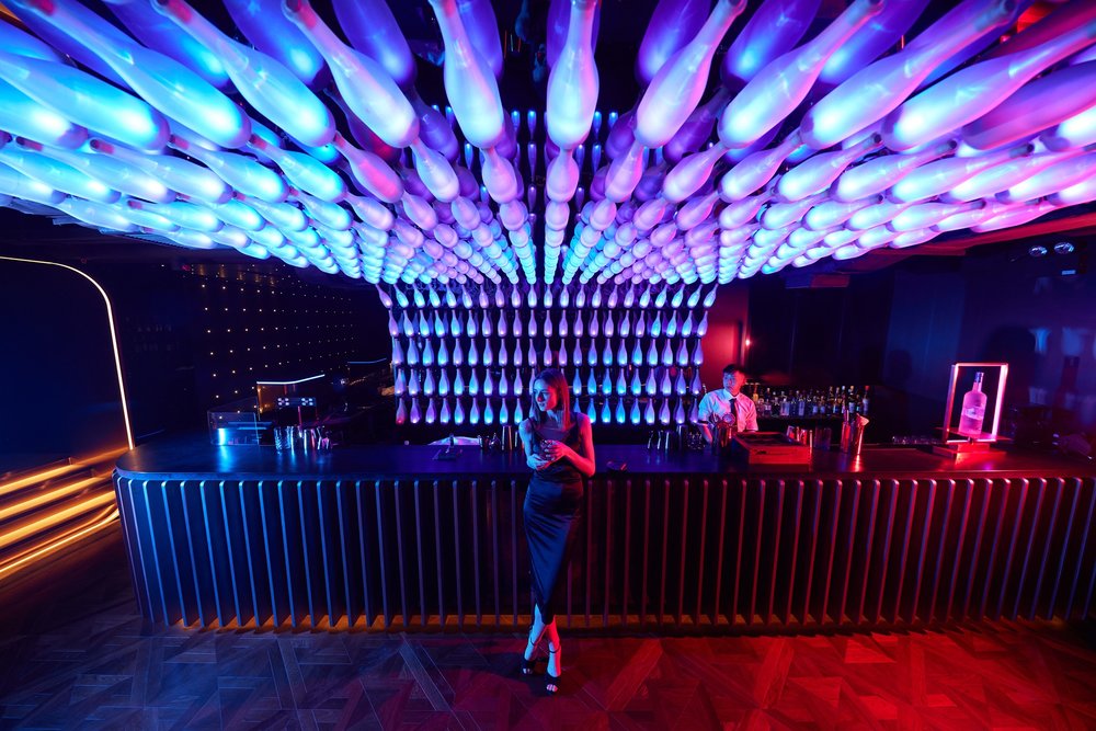 Shuffle bar counter with neon lights