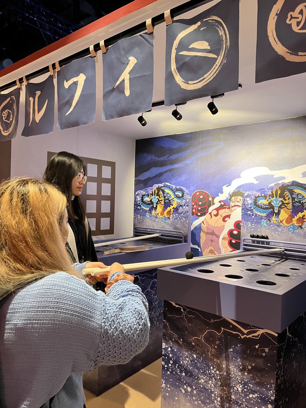 Play carnival games at Wano Country Shopping Street in One Piece Exhibition