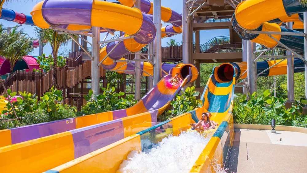 people going down a giant water slide