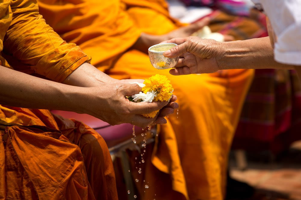 Pouring water in the hand of the elders