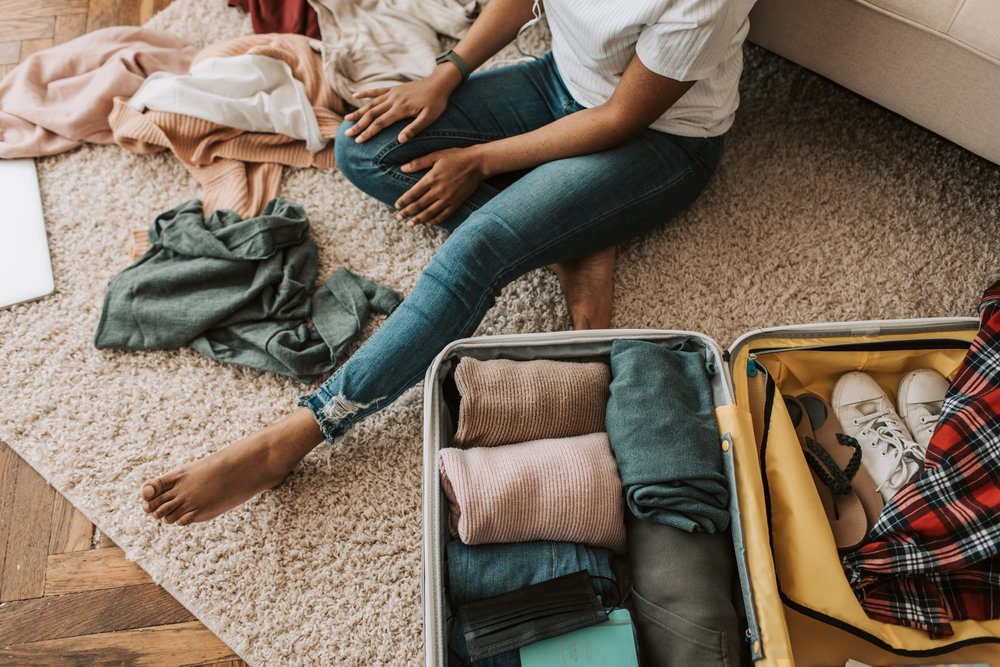 Tourist packing her things