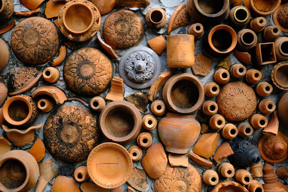 a flatlay of clay pots